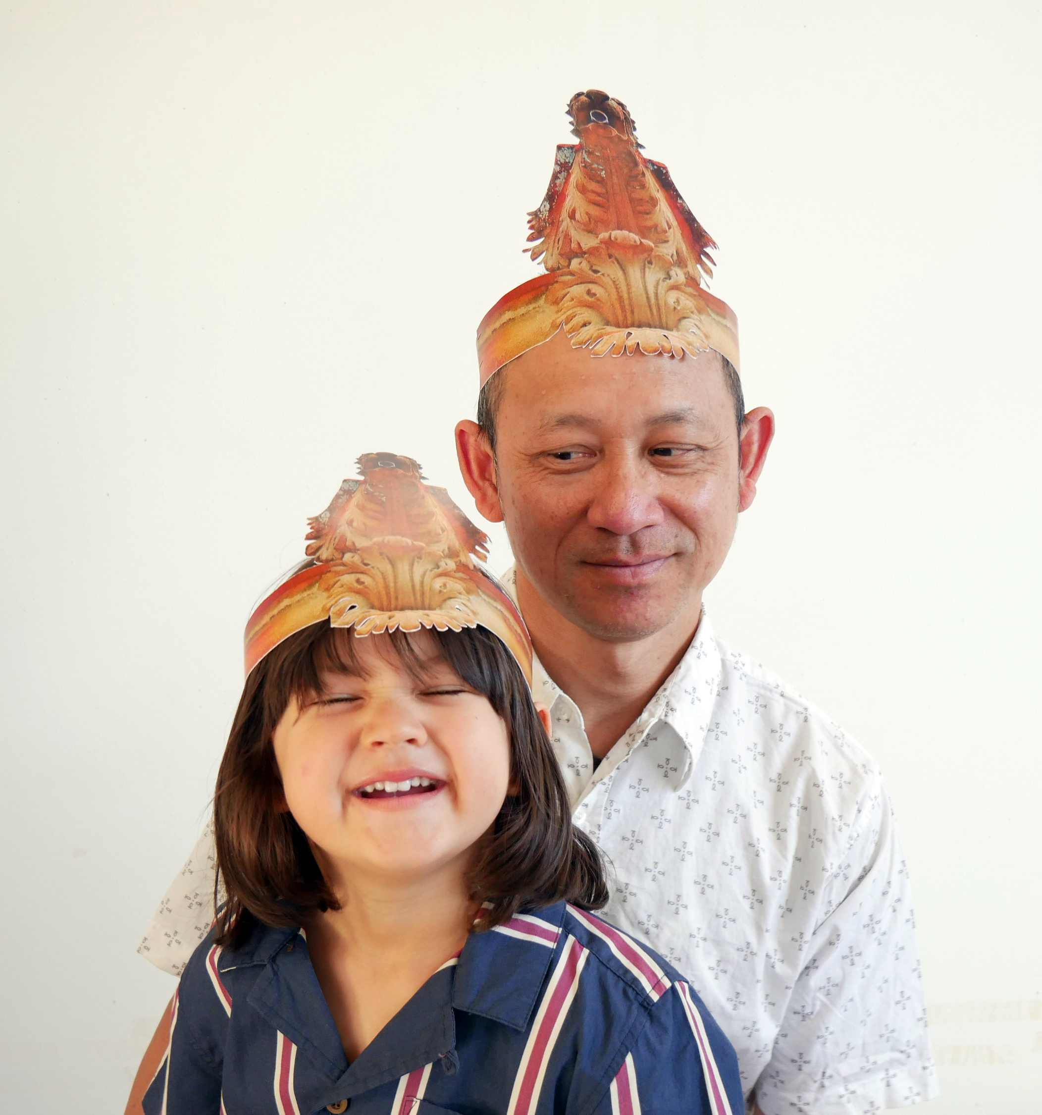 Somchai and Charlie wearing party hats