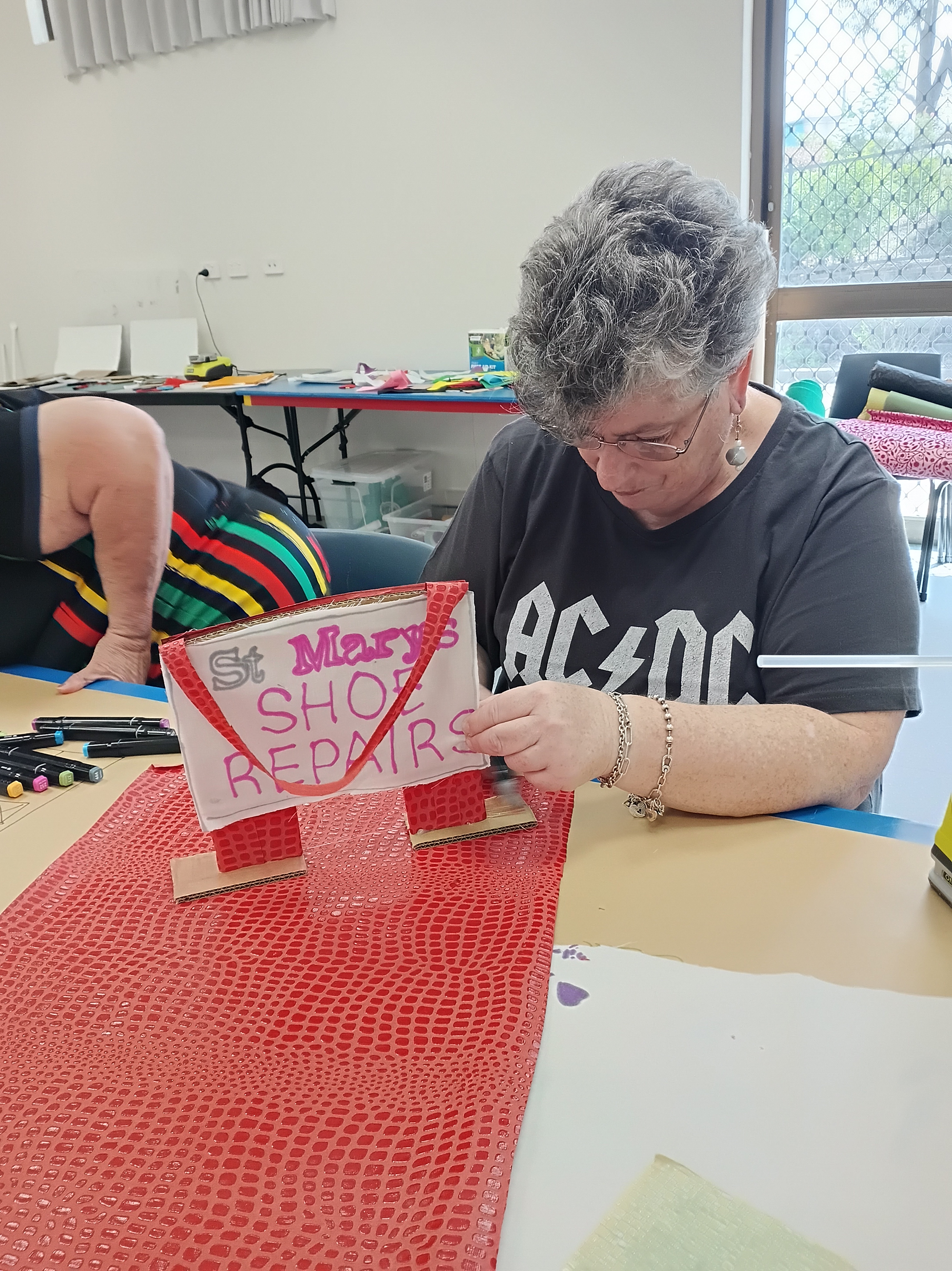 Participant making St Marys put-put golf of St Marys Shoe Repair