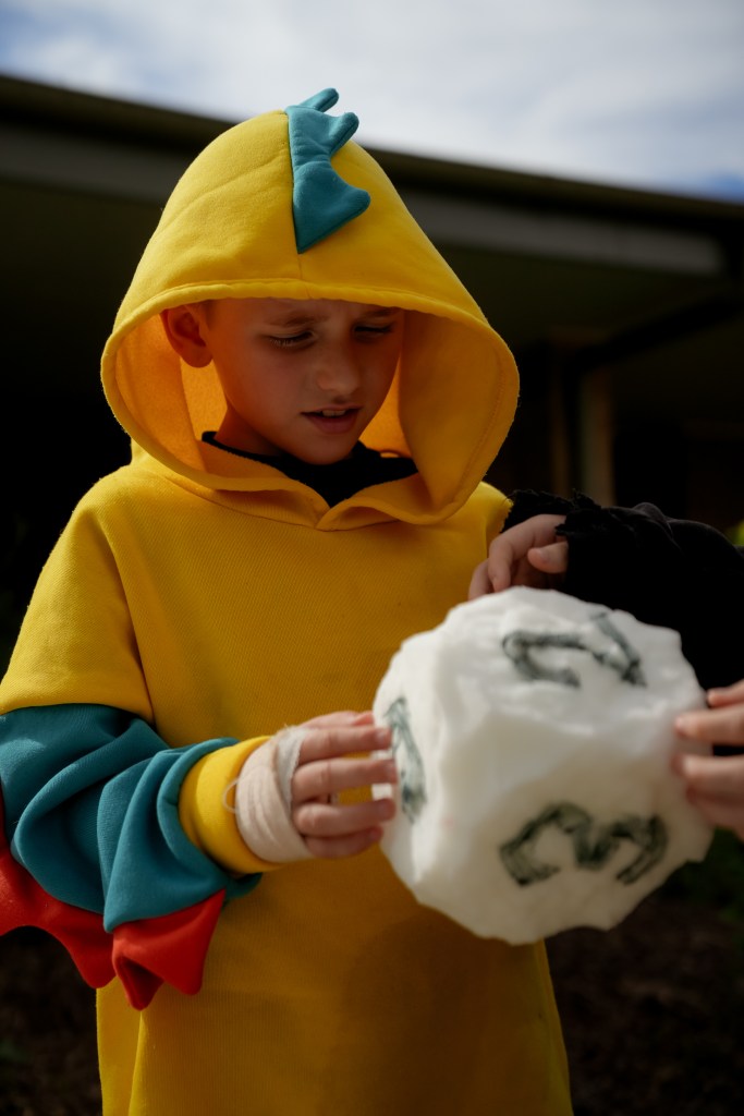 Detail of child with handmade dice
