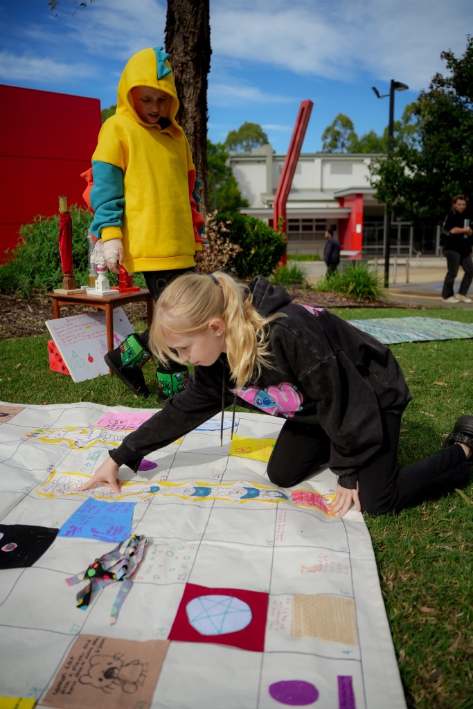 Child playing Up and Down Queen Street at St Marys Art and Games Day