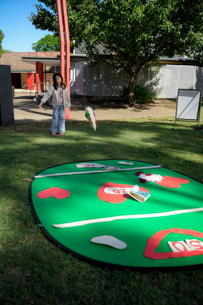 Child playing St Marys Corn Throw at ST Marys Art and Games Day